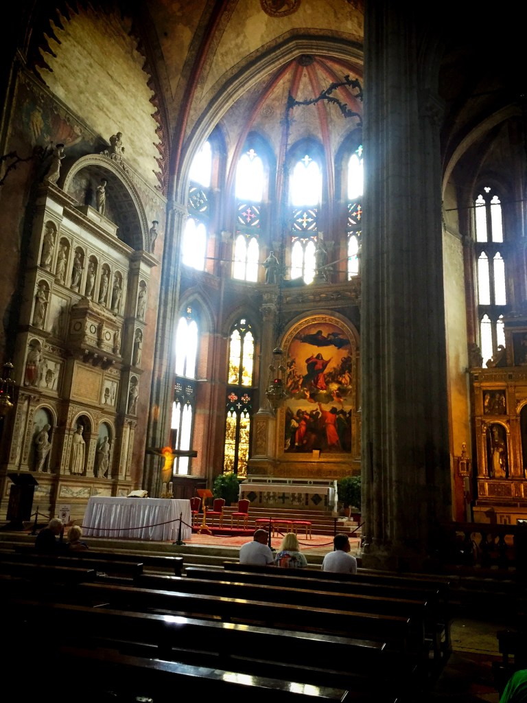 The painting in the middle is the famous work by Titian.